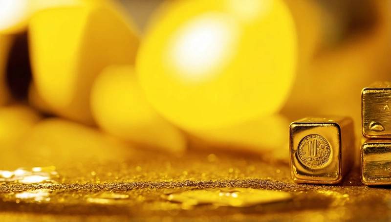 Gold drops from two-week high as dollar rises