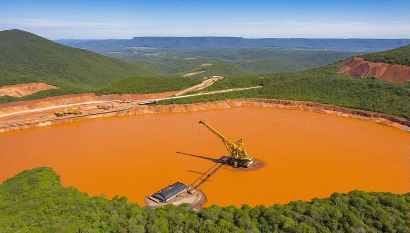 Shares of UK-based Hochschild Mining plummet after it slashes its gold production forecast for a Brazilian mine