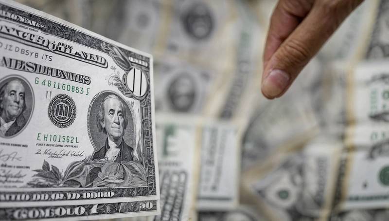 The US dollar gains after Friday's gains and stocks mostly fall.