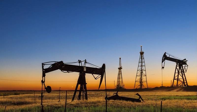 Oil prices drop as investors consider a surplus supply outlook and US-China tensions